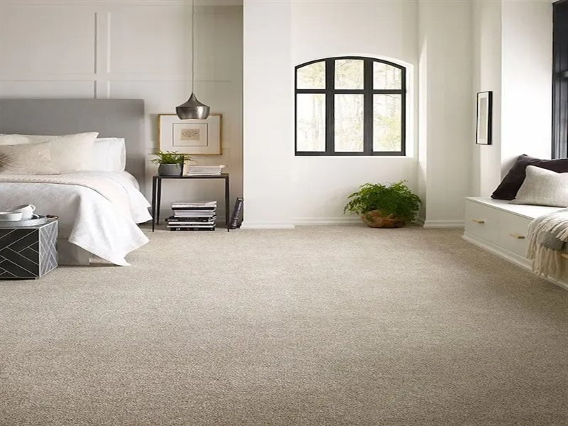 Premium bedroom carpet installation — styled room with plush carpet