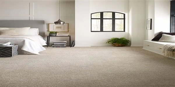 Plush carpet with dense soft surface installed in a bedroom