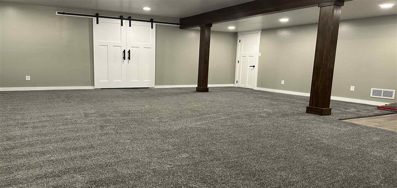 Finished basement with carpet installed